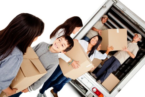 Careful loading of household items into a moving van