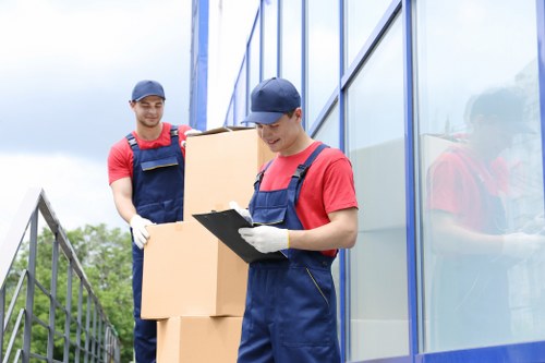 Removalists loading household items in a Notting Hill street