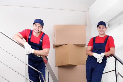 Professional movers handling stair access in a period property in Notting Hill