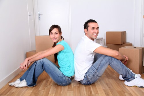 Moving team unloading boxes into a new home in Notting Hill