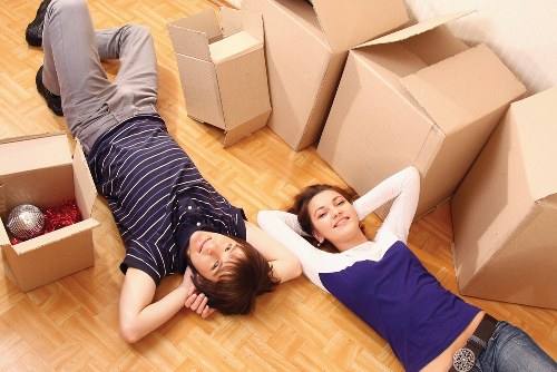 Removal team loading boxes near a Notting Hill mews property
