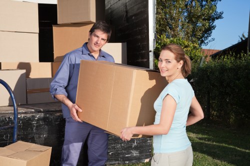 Removal workers reviewing a safety checklist before loading